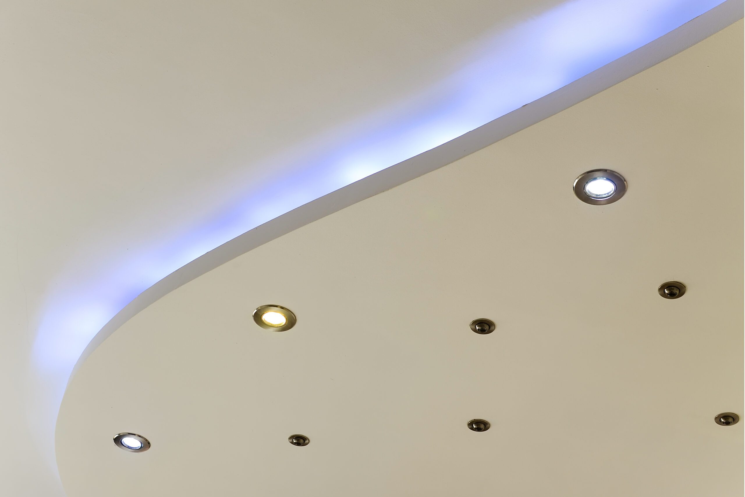 Blue Led Lights Illuminating a White Ceiling.